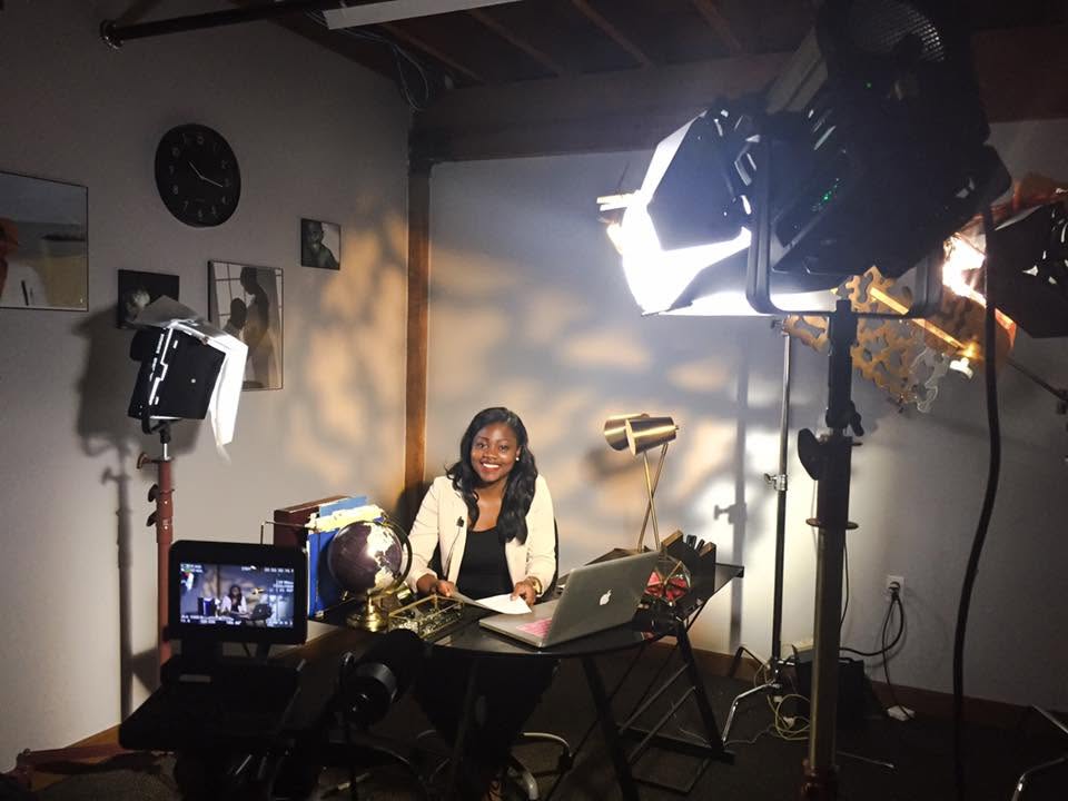 Studio lighting setup surrounding a presenter during a video shoot