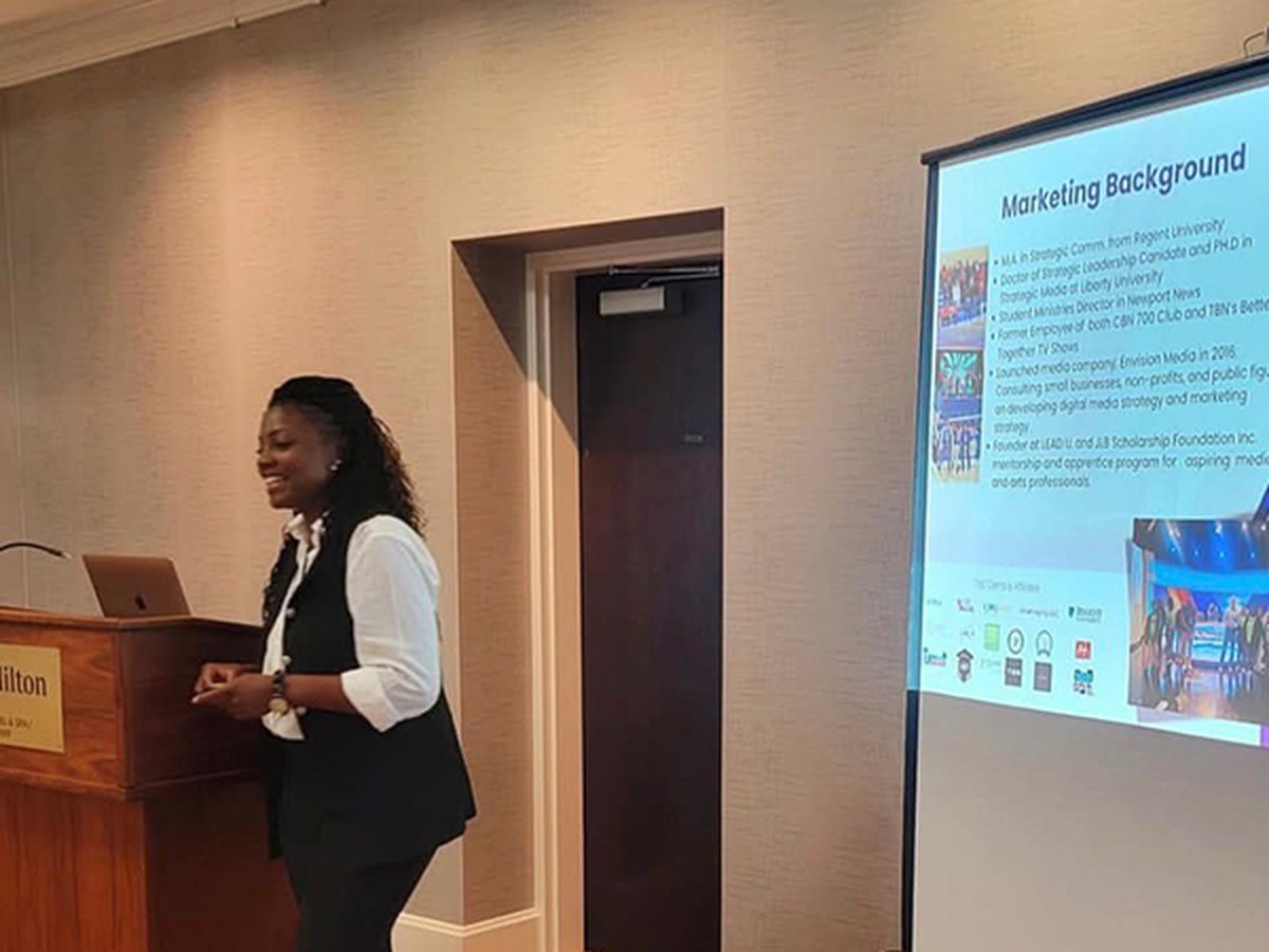 Envision Media founder presenting brand and marketing strategy at a conference
